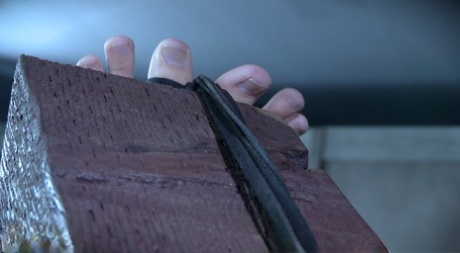 Caucasian redhead Kel Bowie is restrained and penetrated in a dungeon setting 27723159