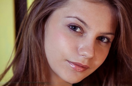 Long legged teen girl Emma Sweet displays her nice ass and bald pussy on couch 15446784