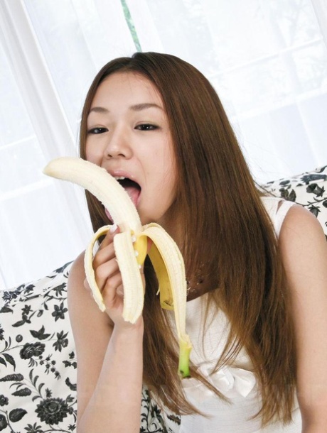 Japanese hottie Sakura Hirota peels a banana before sucking toys and cock 77443570