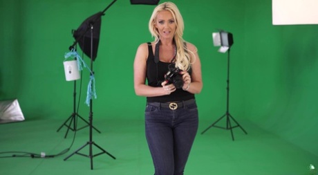 Busty blonde Lucy Zara rubs her pussy during a modelling gig 67624461