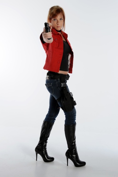 Solo girl Sophie wields a pistol while stripping to black boots 29060099