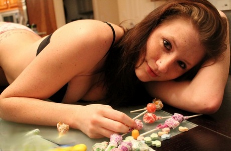 Barely legal girl Freckles 18 adorns her naked body with candy 19243085