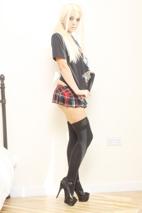 Blonde amateur Stacey Rocks licks a lollipop while getting naked in OTK socks 43959484