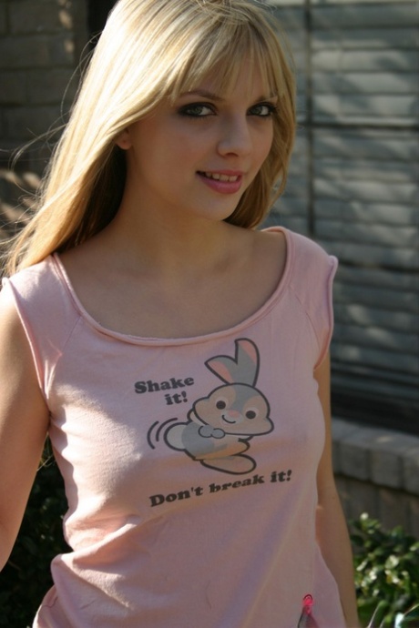 Sweet blonde teen Jana Jordan flashes upskirt panties while eating chocolate 38753520