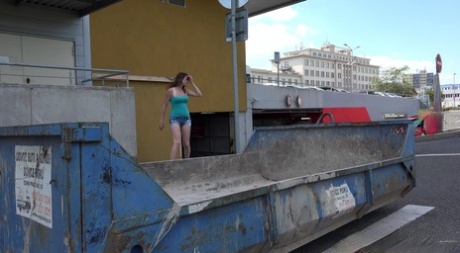 Solo girl Vicky squats for a pee in a refuse container while caught short 80415537