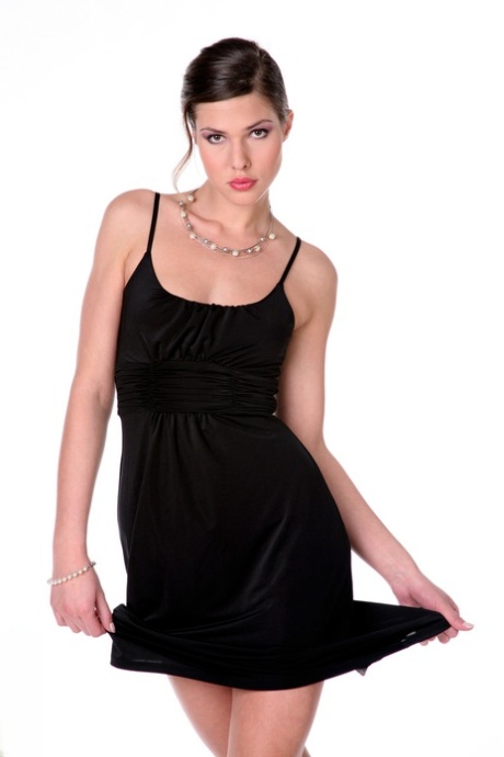 Gorgeous girl with long legs slips out of black dress for confident nude poses 90166924