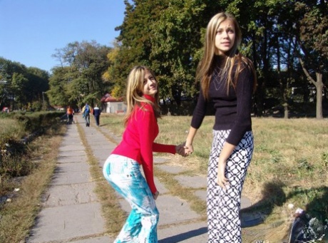 Young lesbians Laura & Katrina hump each other while fully clothed outdoors 30968046