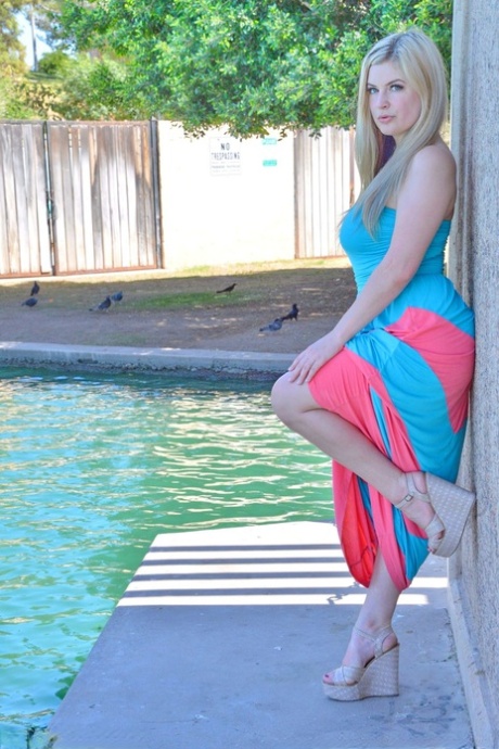 Blonde first timer lifts up her long dress to masturbate by the pool 57405009