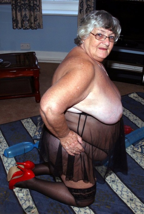 Overweight British woman Grandma Libby plays with balloon dildos in lingerie 29123821