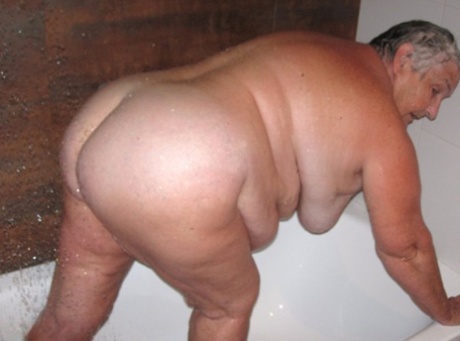 Obese amateur Grandma Libby blow drys her hair after taking a shower 94376629