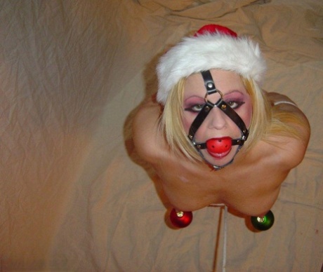 Blonde MILF sports a ball gag before giving a POV blowjob and handjob 13152055