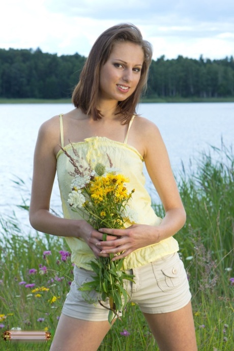 Nice young girl Alba fingers her hairless vagina amid wildflowers 45234851