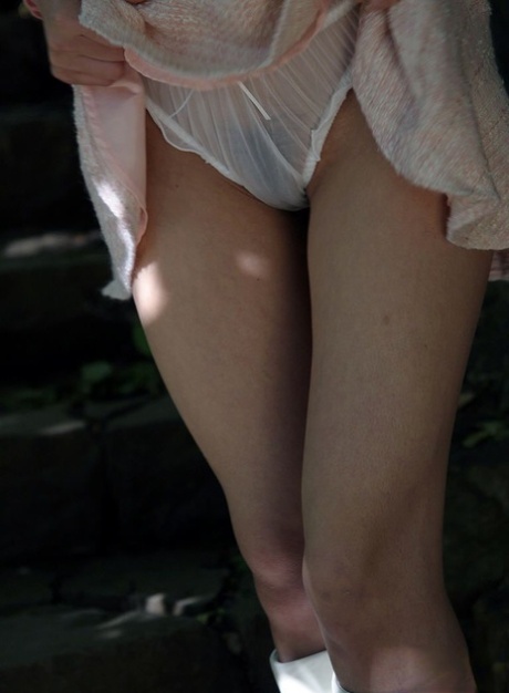 Cute Japanese girl Nana flashes her firm tits and cotton panties in the garden 82439182