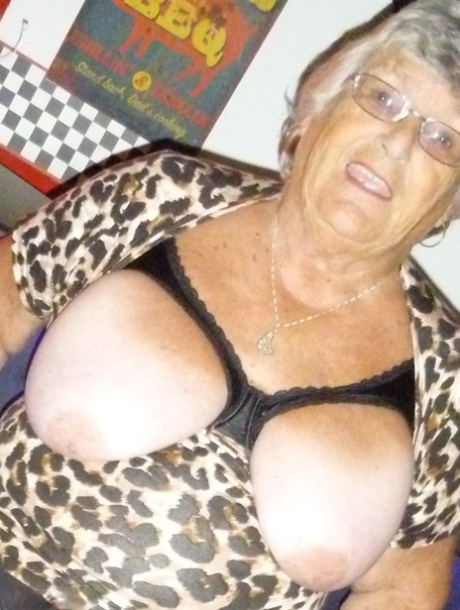 Fat nan Grandma Libby holds her big saggy tits in hand in nylons and garters 98259905