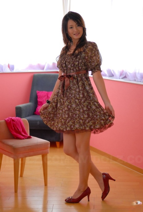 Japanese teen with a pretty face shows her legs in a short dress and heels 33755889