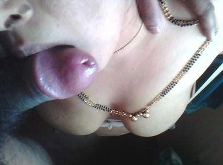 Indian woman exposes her natural tits while giving a POV blowjob 48297217