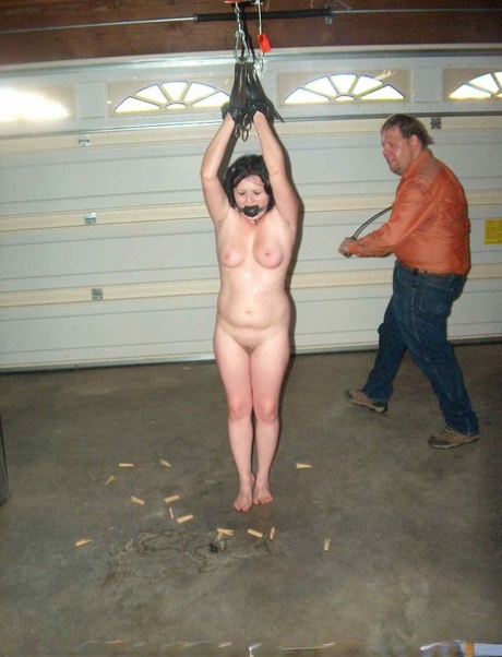 Naked chick is shocked with a electricity while gagged with hands above head 18114608
