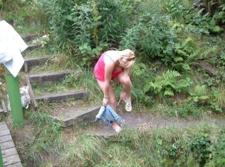 Overweight UK female with blonde hair strips naked on a popular walking trails