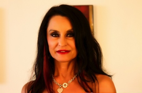 Busty granny Rita Daniels has interracial sex with a younger man on a couch 81112758