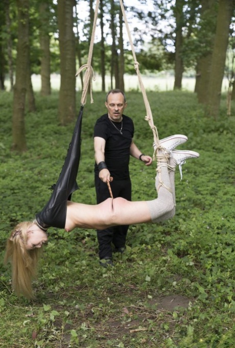 Blonde girl Candee Licious sucks a cock after being caned during BDSM action 13855091