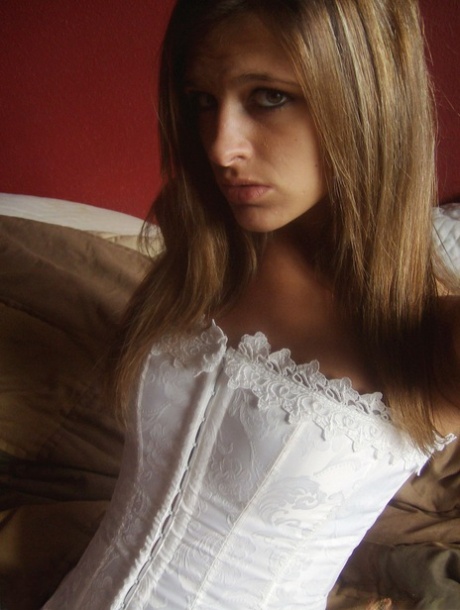 Amateur model Adri poses at home in a white corset and pantyhose 48415906