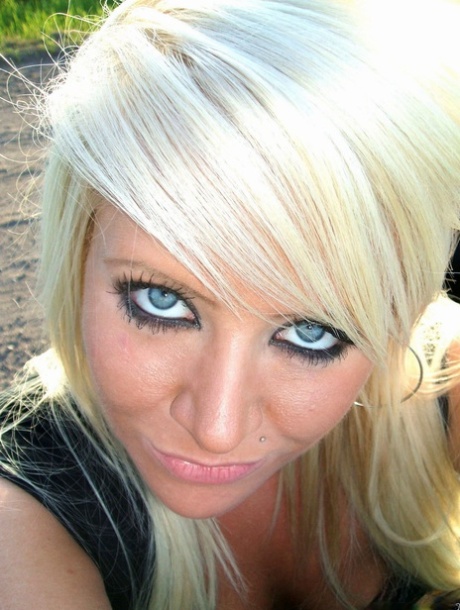Blonde girl with striking eyes takes tempting selfies while in her car 74480423
