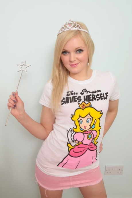 Cute blonde Jessica gets naked on top of her bed in over the knee socks 85194573