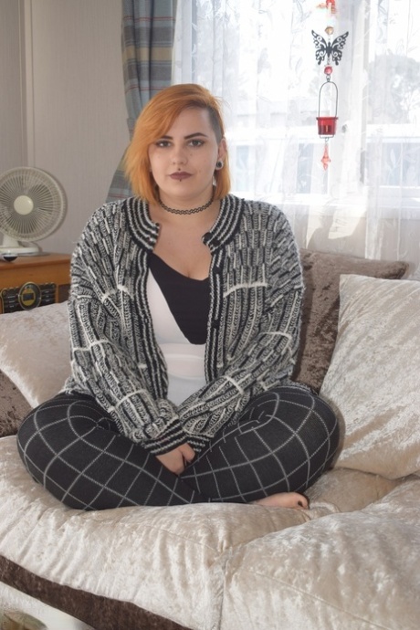 Fat redhead Phillipas Ladies stands naked after disrobing on a couch 38905062