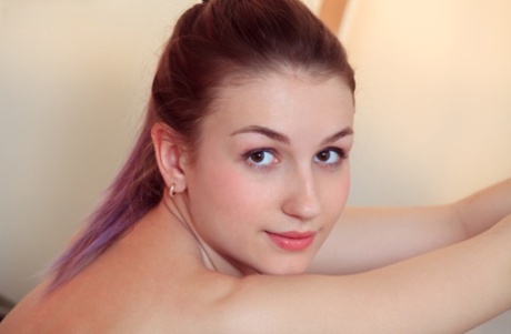 Young redhead Sacha slips out of her lingerie and panties to get naked 91780094