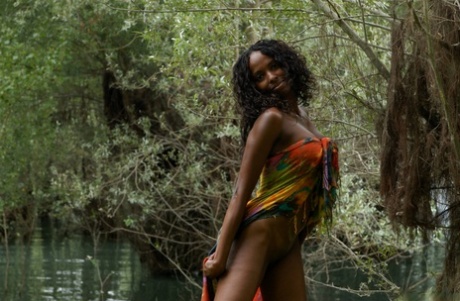 Black girl Celia shows her vagina while modelling near a swamp 43340567