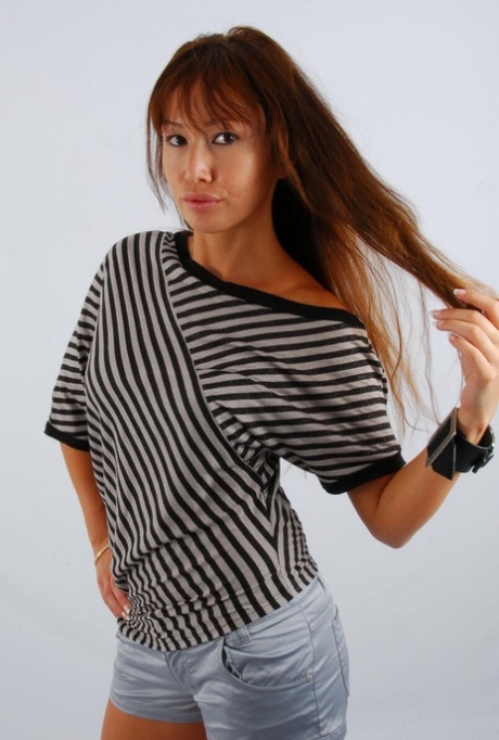 Asian redhead Evita glances at her huge Frilis watch while fully clothed 69783661