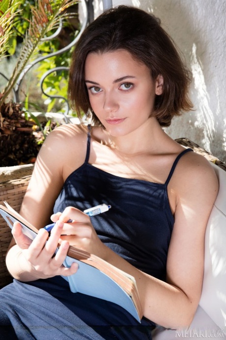 Petite teen Kertu scribbles in her diary before getting totally naked 19750132