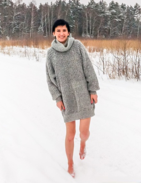 Naked girl short black hair Claudia kneels on snow-covered ground while gagged 96851532