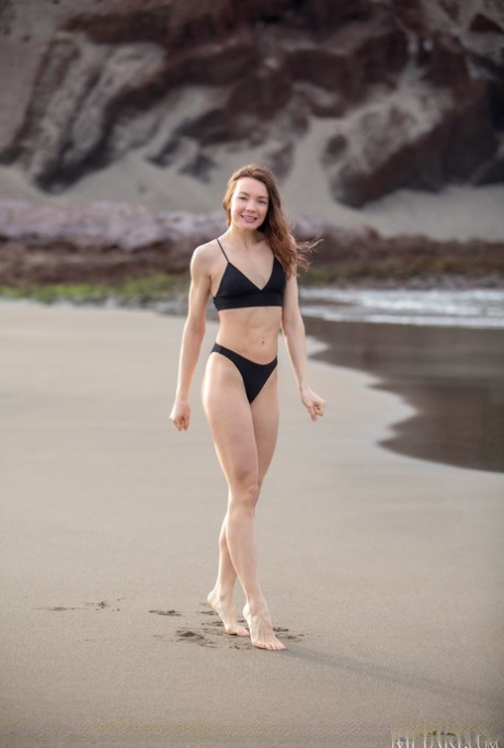 Girl next door type Janeth Tense gets completely naked on a sandy beach 30370878