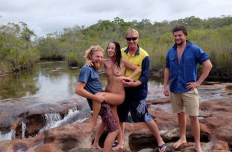 Naked girl Roxeanne is fondled by a bunch of guys before chugging a beer 24915141