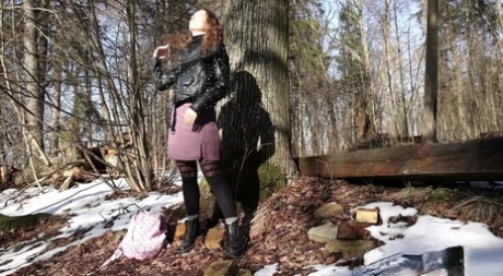 Nice girl Nikky B gets caught taking a pee next to an old tree on a spring day 32557297