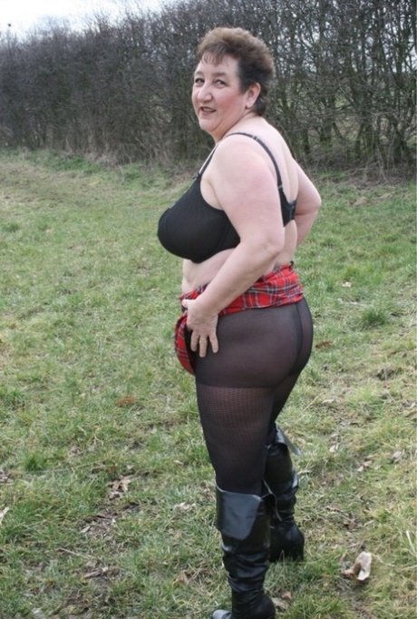 Older British plumper Kinky Carol unveils her big boobs outdoors in pantyhose 39154459
