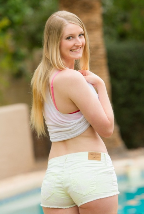 Natural blonde Summer Carter gets totally naked near a swimming pool 54424337