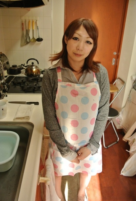 Japanese housewife Eri Fujino shows her tits and ass in an apron 95165580