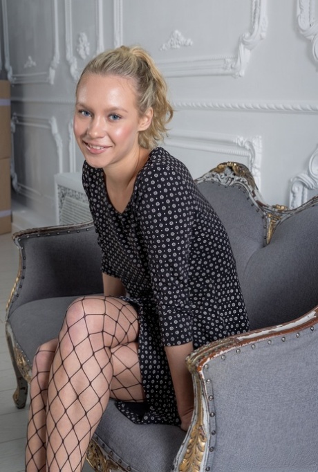 Blonde teen Stefany removes fishnet pantyhose to get totally naked 39599963
