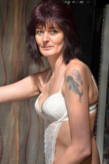 Older housewife Biggi Bitch goes topless in nylons at an adult video store 39012782
