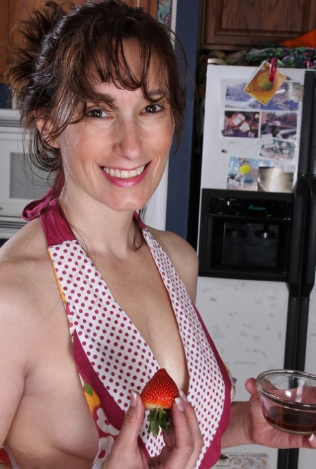 Middle-aged lady Celeste Carpenter takes off her apron to pose nude in kitchen 47493054