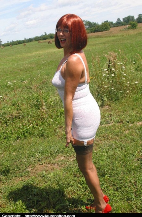 Natural redhead Miss Abigail wanders into field in her girdle and nylons 46208628
