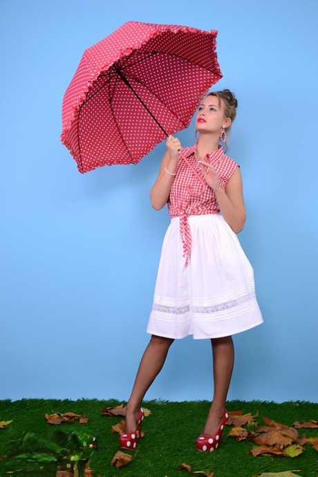 Pinup model Kelli Smith loses her clothes and hose while holding an umbrella 69154294