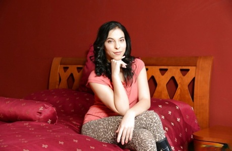 European milf with charming smile Candy Belle lies on bed and poses 62501885