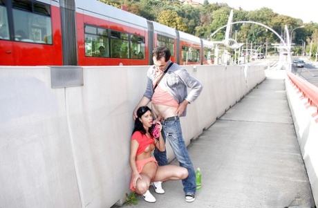 Young brunette slut sucks off an older man on public walkway 69304662