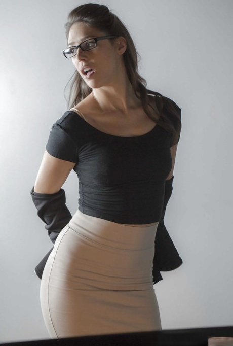 Glasses topped brunette babe Anna Morna taking upskirt self shot in office 88478292