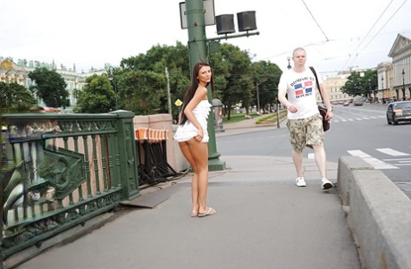 Graceful brunette babe on high heels flashing her titties in public place 50363170